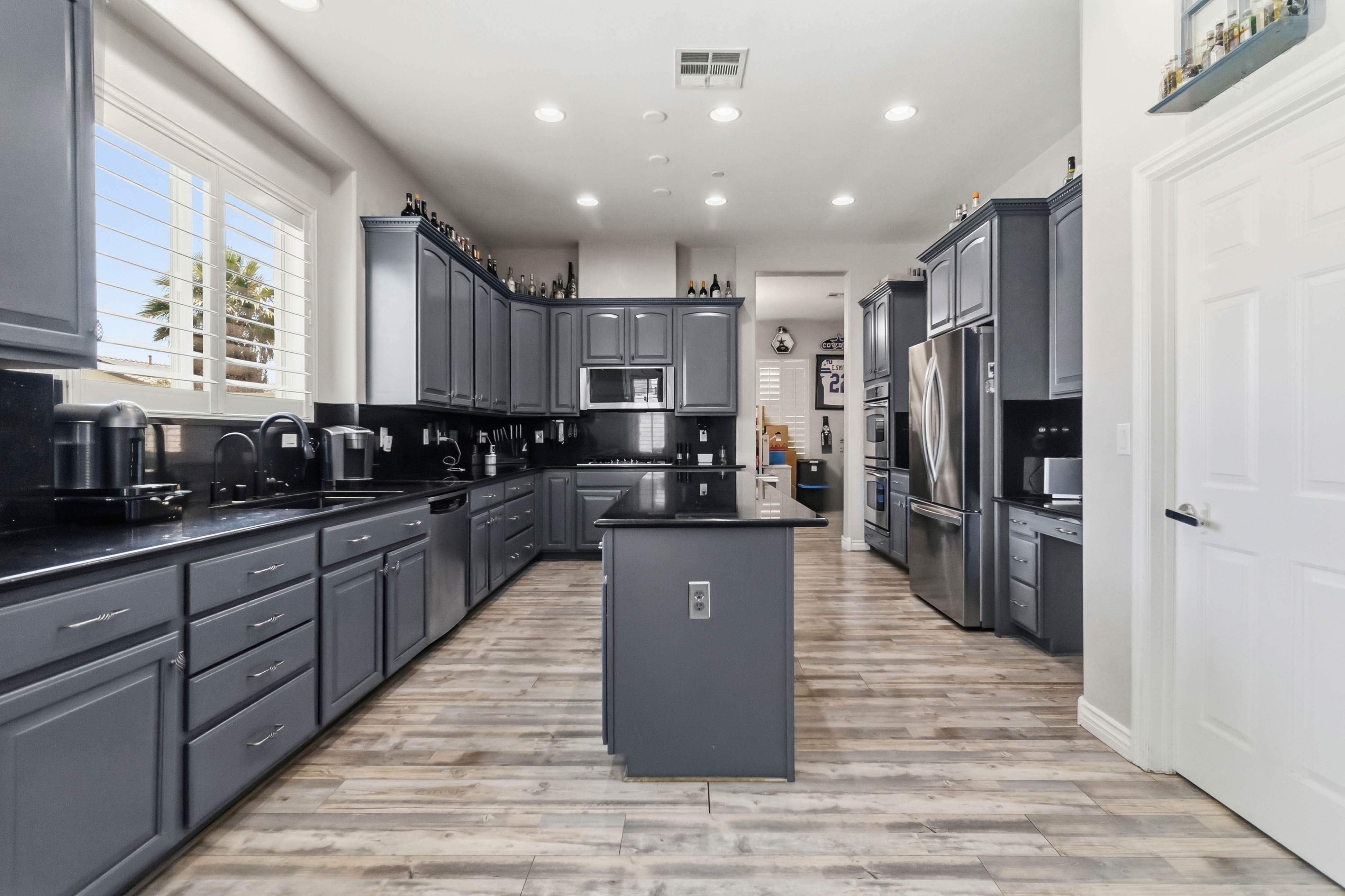 Kitchen view at 9564 Trattoria Street with generous prep space and upgraded appliances