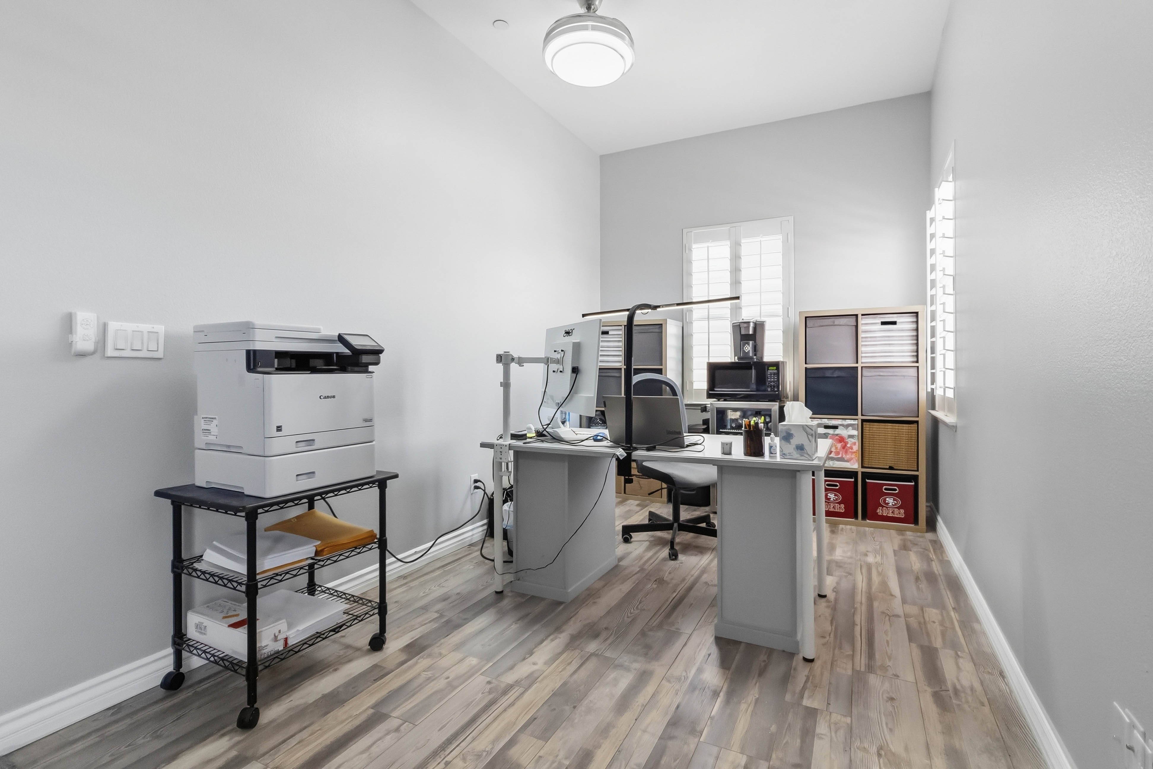 Dedicated office or bonus room at 9564 Trattoria Street with desk setup and cabinetry