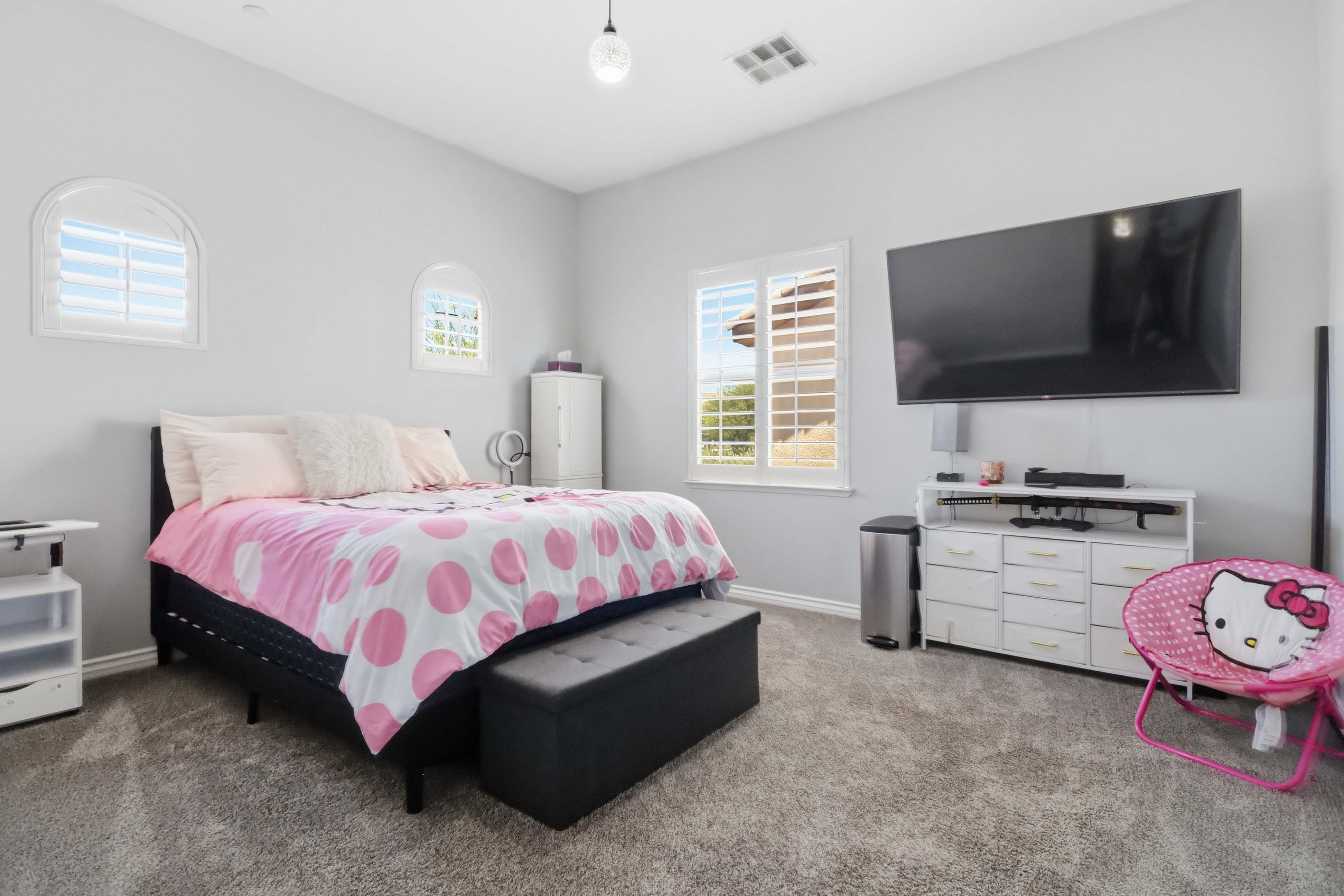 Secondary bedroom at 9564 Trattoria Street with soft carpet and natural light