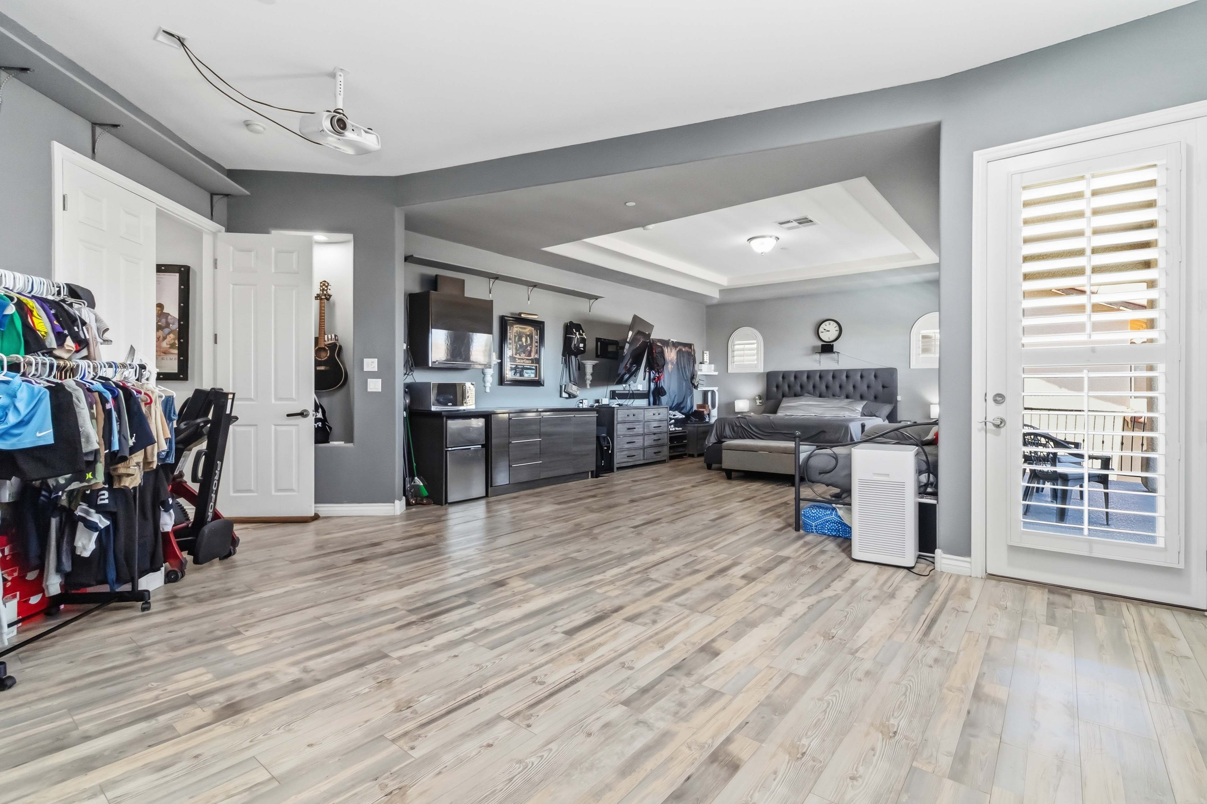 Primary bedroom at 9564 Trattoria Street with spacious open layout and lounge area