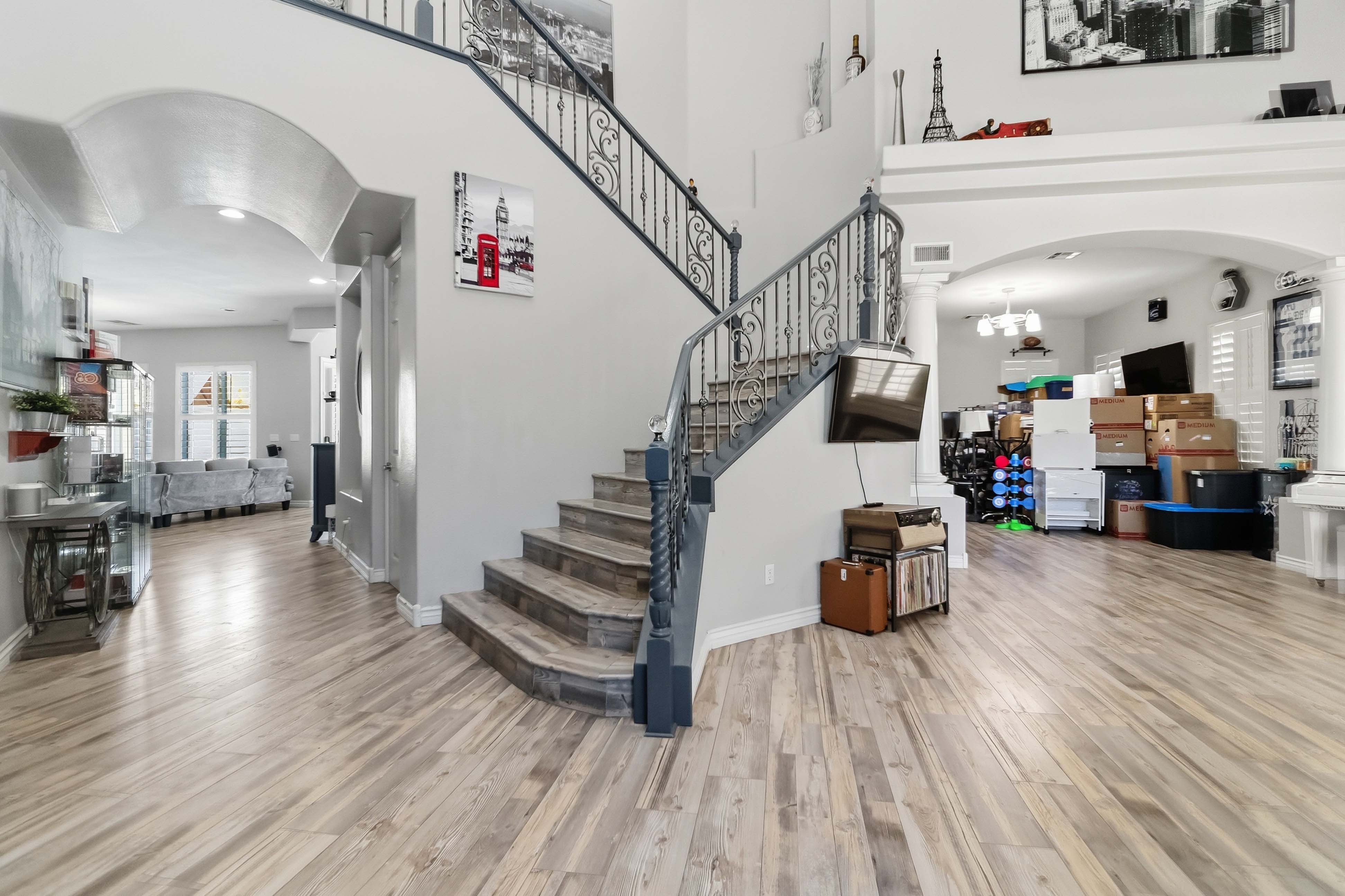 Open entry hall and staircase at 9564 Trattoria Street with high ceilings and natural light