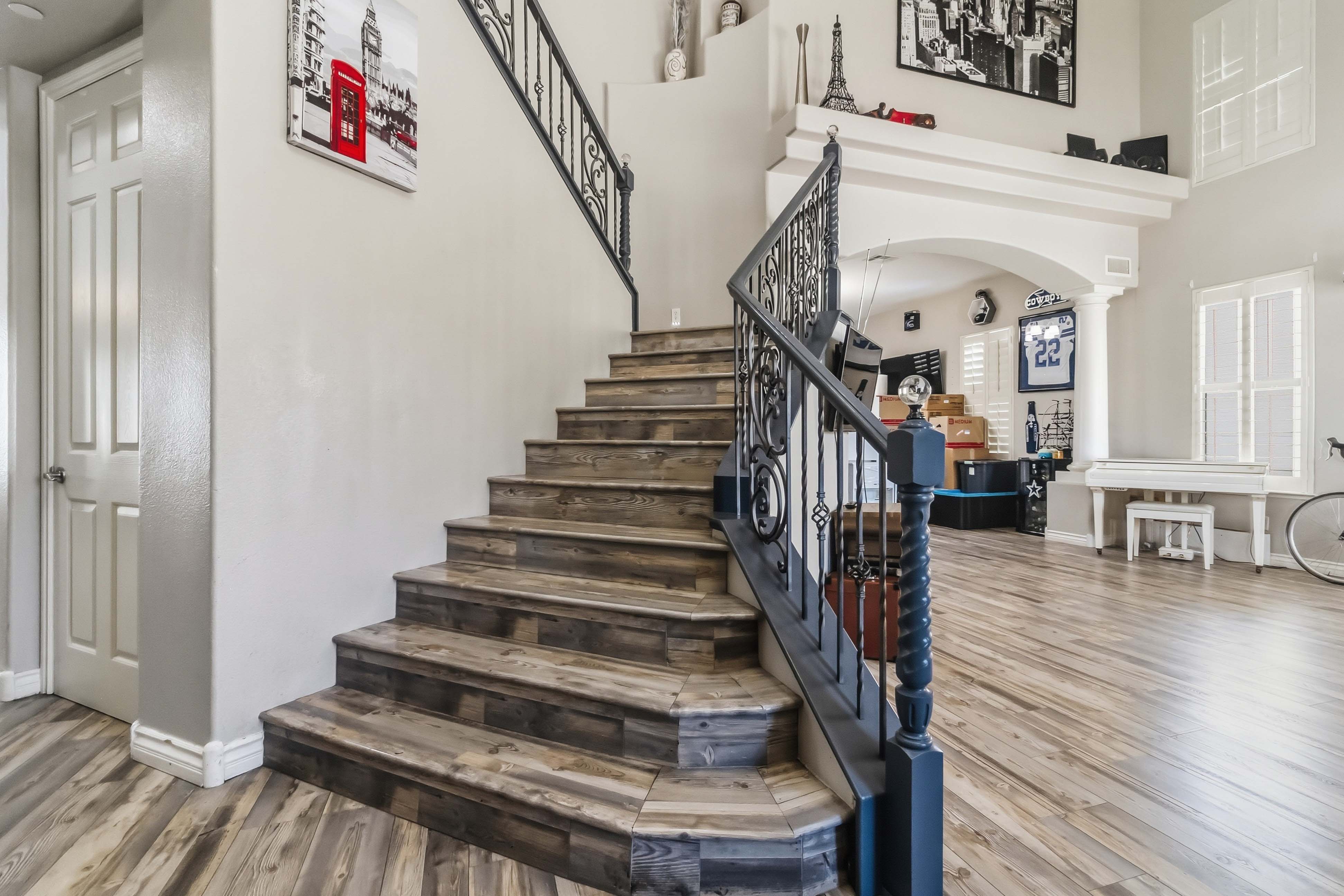 Upper landing at 9564 Trattoria Street with staircase and open loft-style overlook