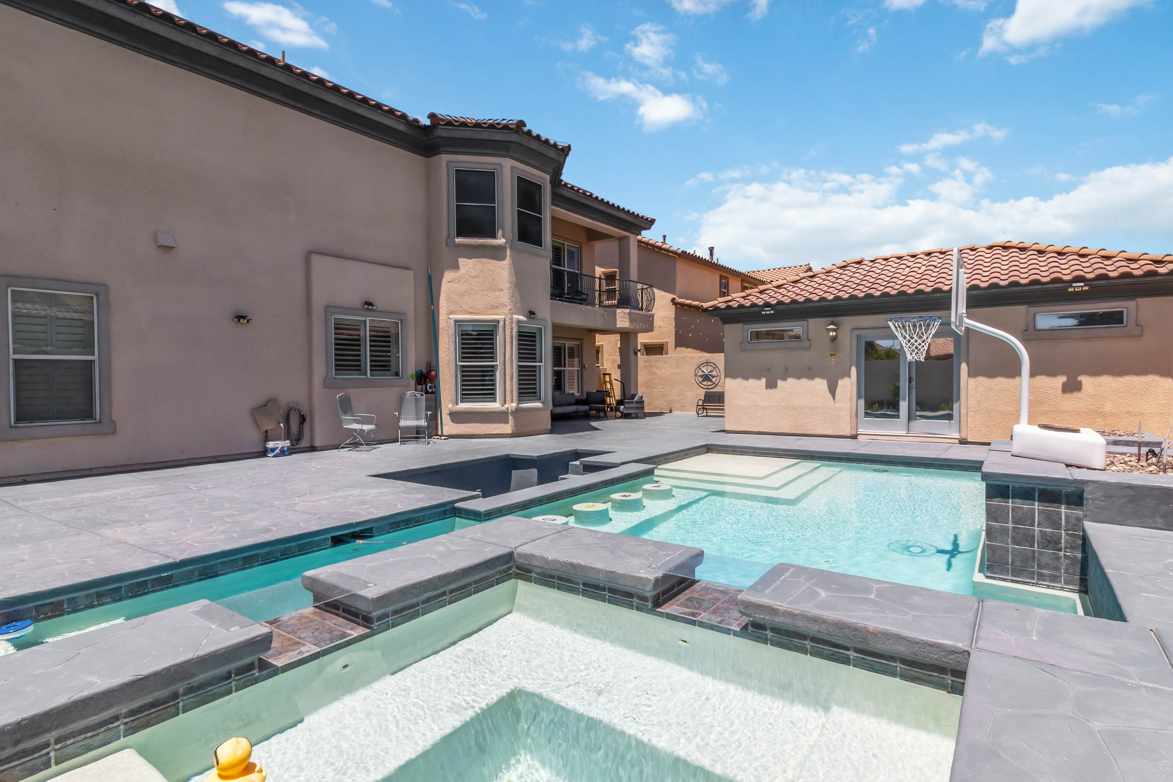 Additional balcony view at 9564 Trattoria Street with rooftops and mountain sky