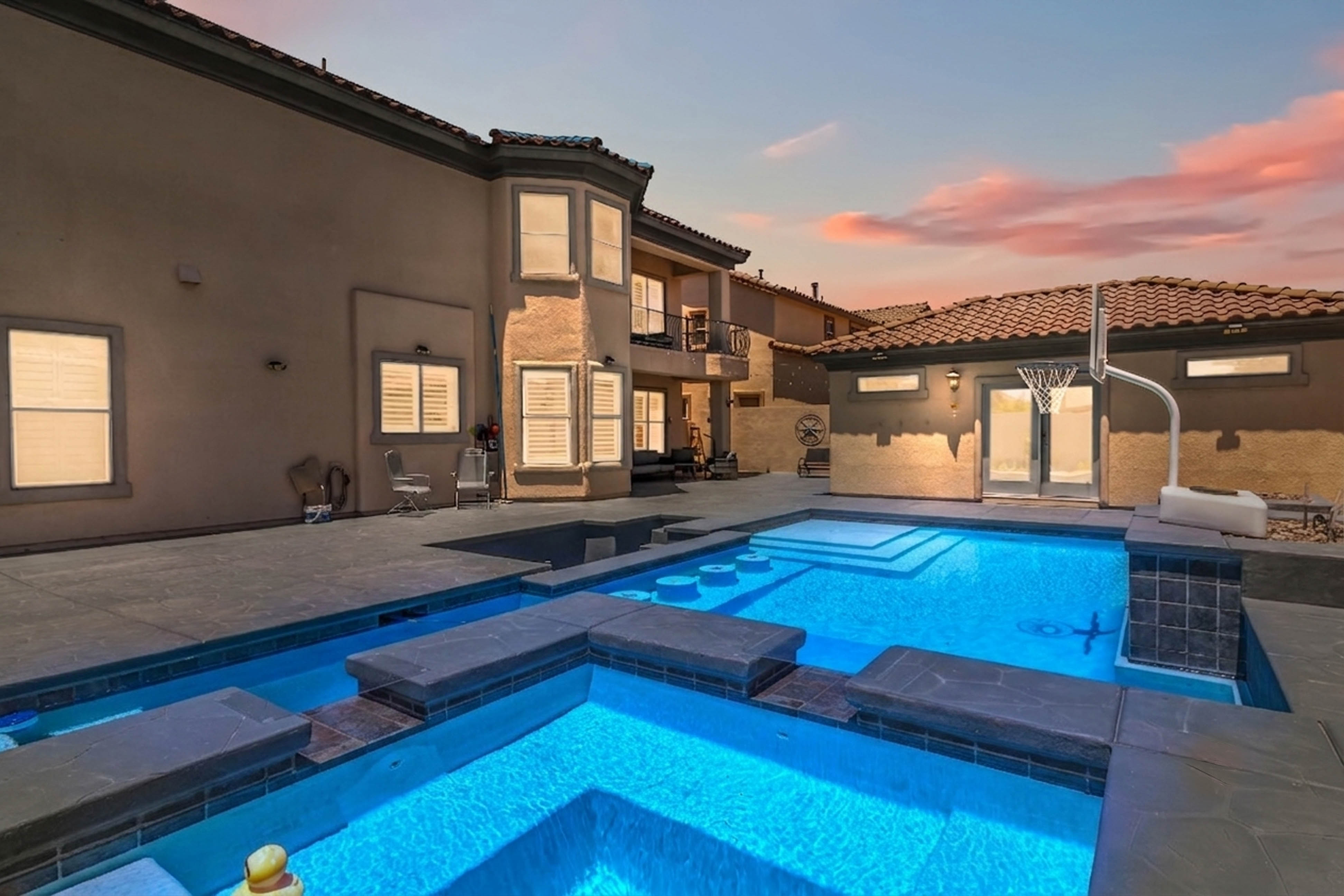 Upper balcony view from 9564 Trattoria Street overlooking the backyard and neighboring homes
