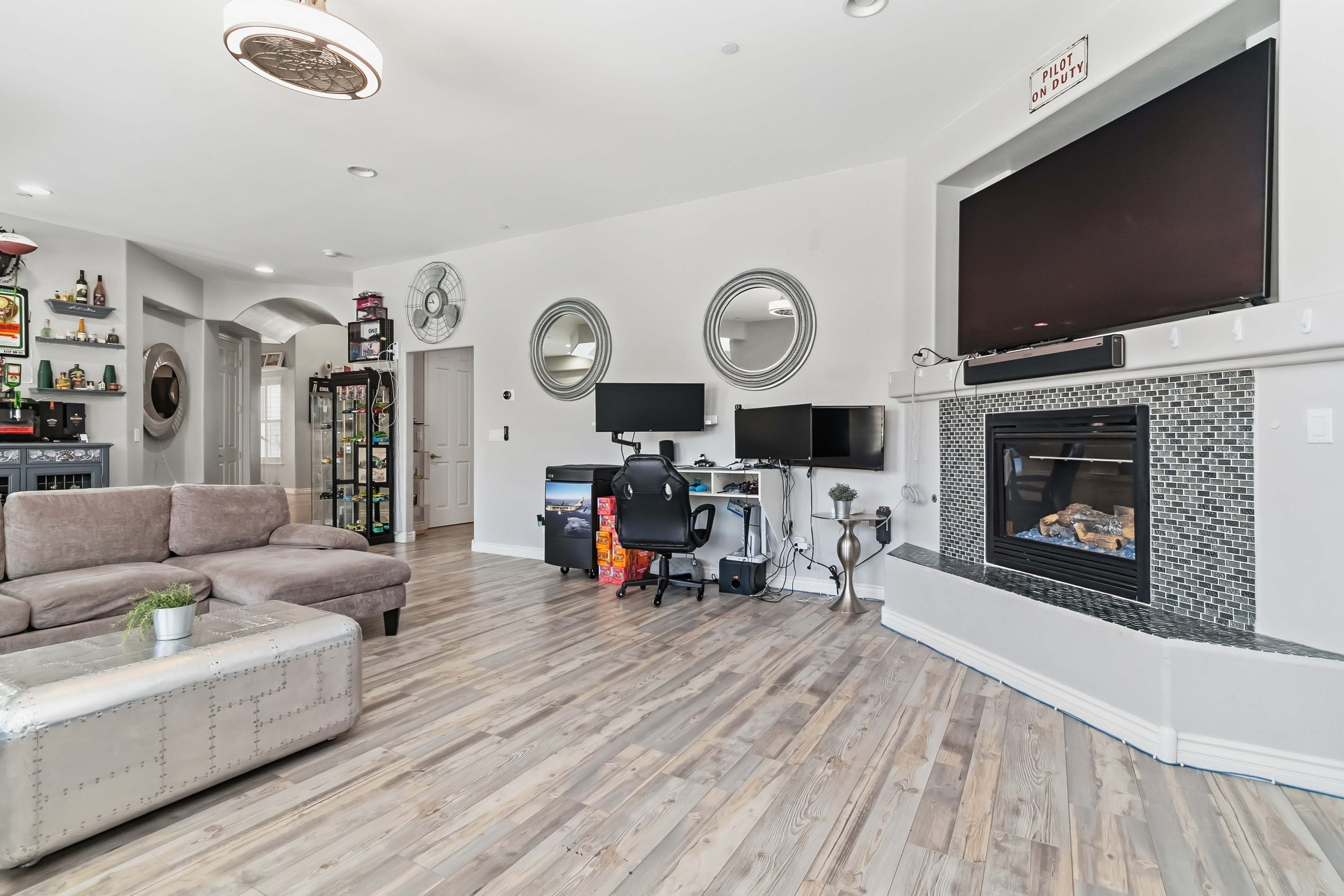Second angle of the great room fireplace wall at 9564 Trattoria Street