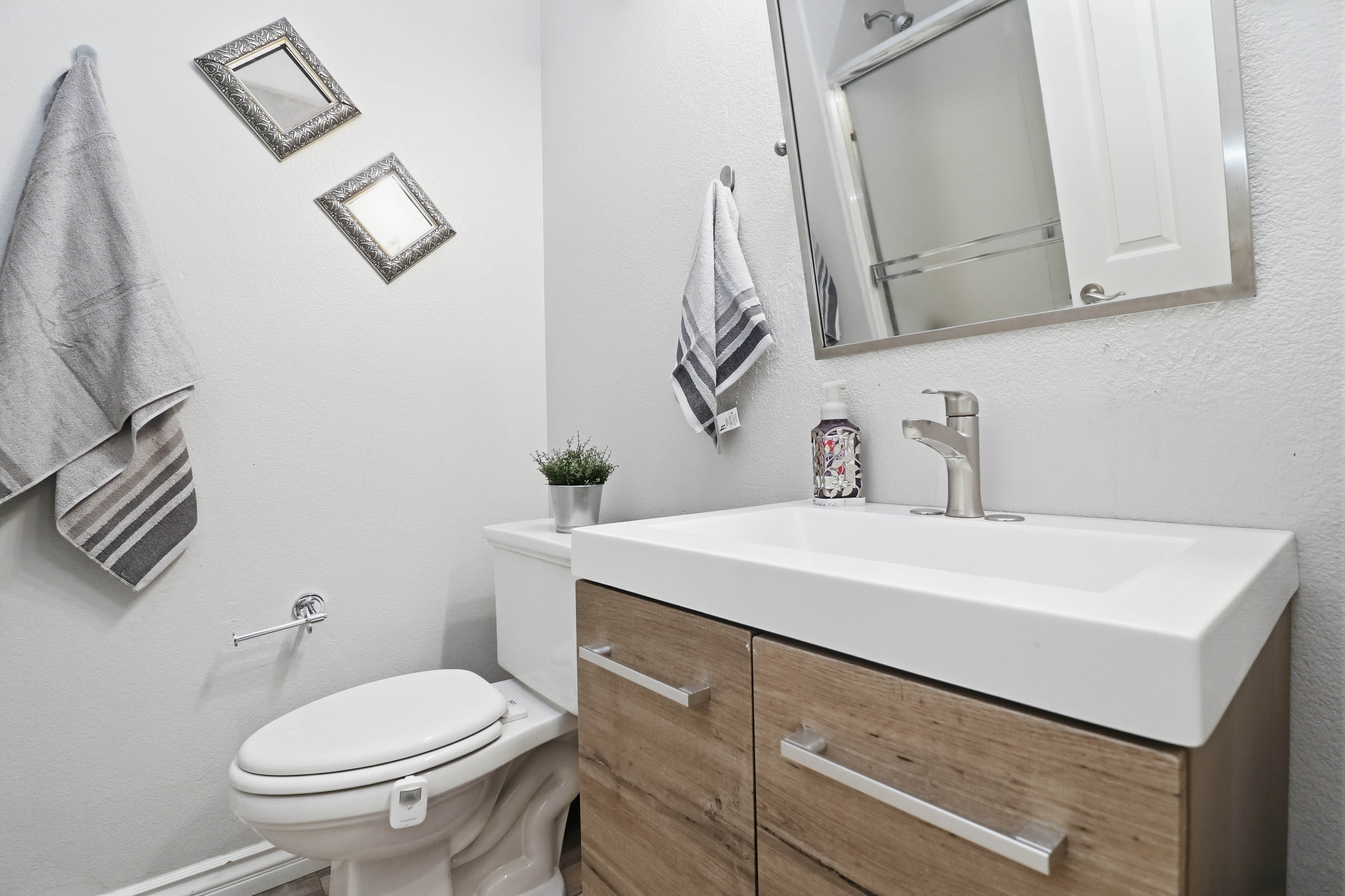 Powder room at 9564 Trattoria Street with modern vanity and designer finishes