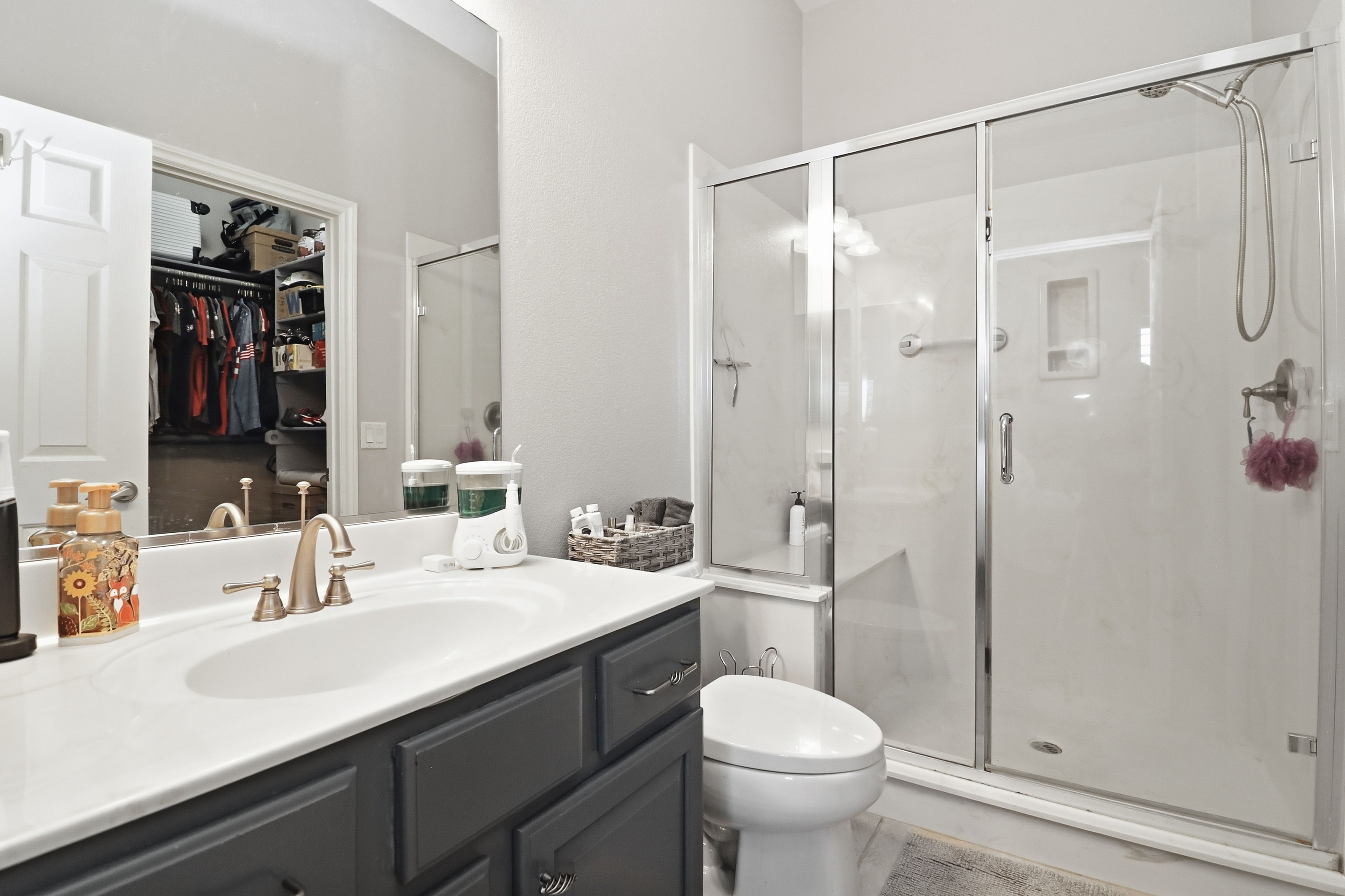 Laundry room at 9564 Trattoria Street with side-by-side front-load washer and dryer
